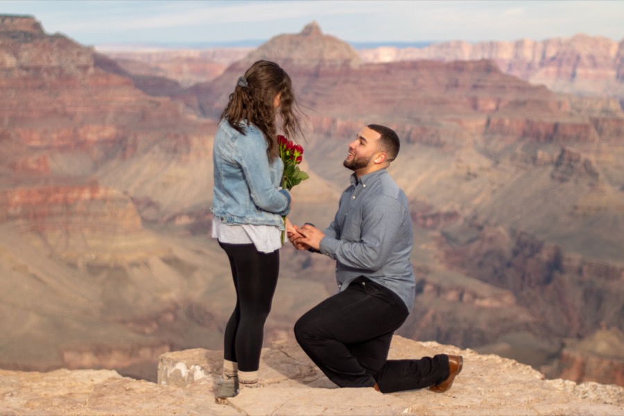 A proposal on one knee at the rim of the Grand Canyon